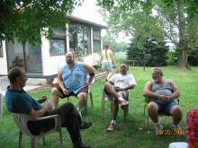 Dad chats with the other men of the family