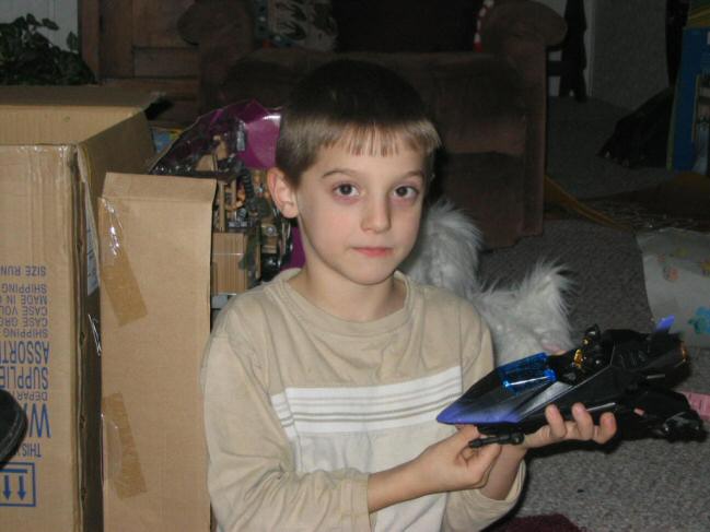 Trevor shows off his new Batman toy